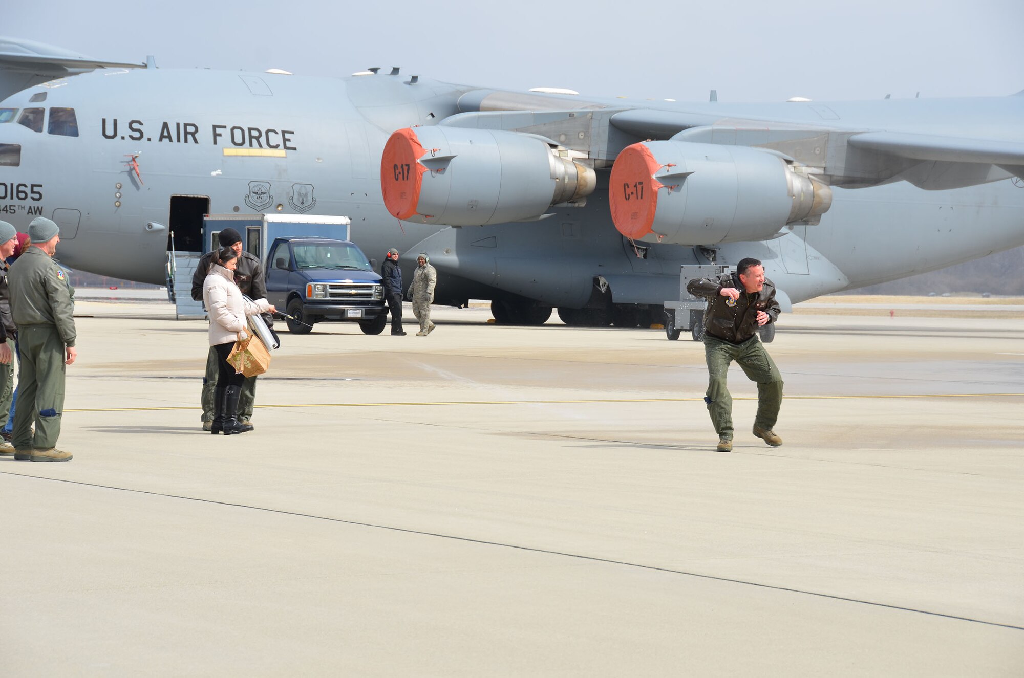 WRIGHT-PATTERSON AIR FORCE BASE, Ohio – Col. Kenneth Council, 445th Operations Group commander, celebrates his final C-17 flight, or “fini flight,” here March 21 with family and friends. A fini flight is a time-honored military aviation tradition marking the end of a pilot’s or commander’s time upon completion of their final flight. (U.S. Air Force photo/Stacy Vaughn)