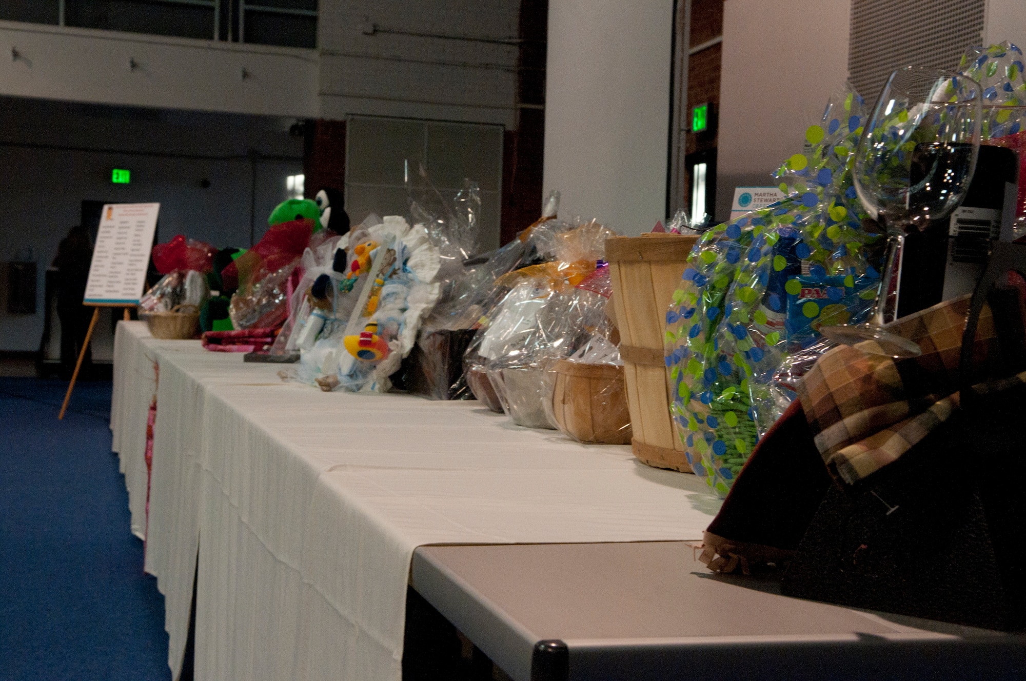 Baskets of items for auction sit on tables for a silent auction held in the Fall Hall Community Center March 16. The silent auction was part of a larger event, the seventh annual “Dollars for Scholars” Basket Auction, hosted by the Warren Spouses Club to raise money to give as scholarships to military dependents. (U.S. Air Force photo by Airman 1st Class Jason Wiese)