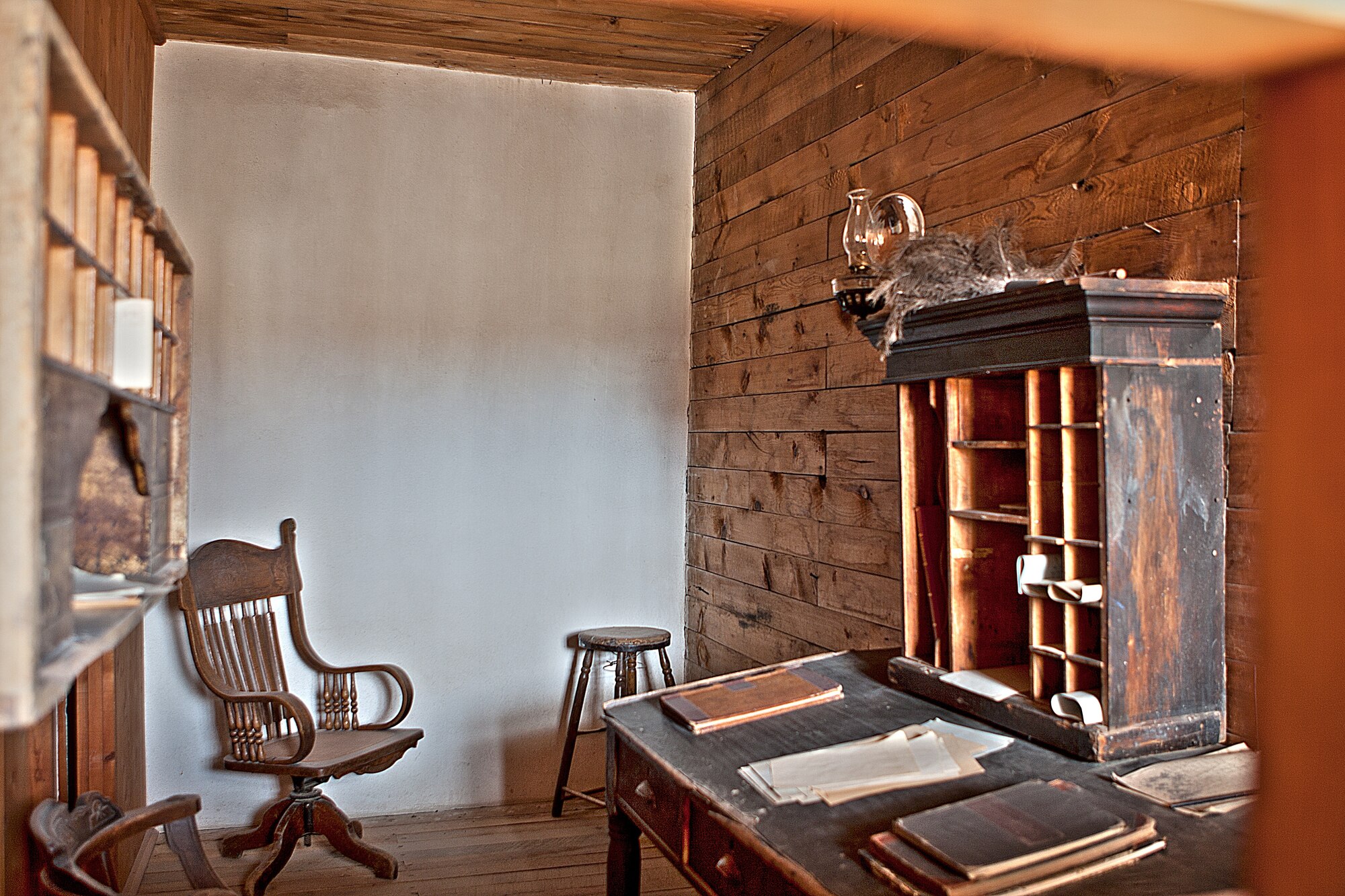 An interior view of the post office at Fort Laramie. The Pony Express made a regular stop at Fort Laramie during their brief tenure delivering mail on horseback. (U.S. Air Force photo by Matt Bilden)