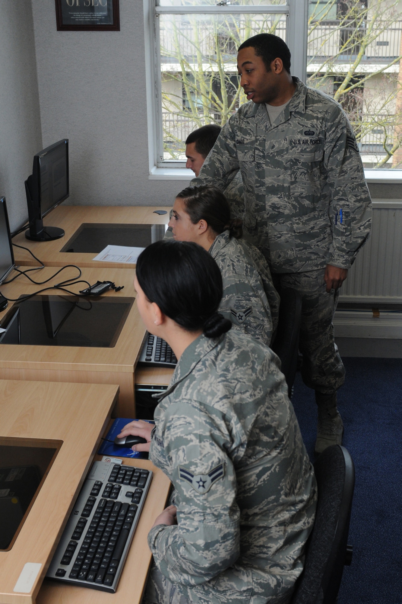 ROYAL AIR FORCE LAKENHEATH, England -- Staff Sgt. Ryan Carr, 48th Maintenance Group knowledge operations manager and First Term Airmen Center course cadre, shows Airmen how to access the Advanced Distributed Learning Service on the Air Force Portal so they can begin taking mandatory computer based training courses March 13, 2013. The newly arrived Lakenheath Airmen participate in the five-day-long FTAC course designed to transition them from a training environment to the operational Air Force. (U.S. Air Force photo by Airmen 1st Class Dana J. Butler)