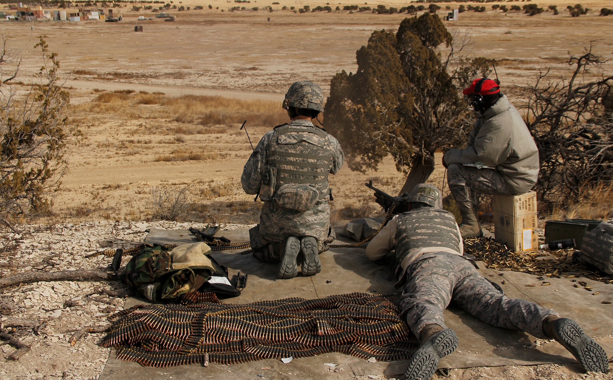 Senior Airman David Eastridge, a fire team member with the 302nd Security Forces Squadron, completes his annual training on the M249 machine gun firing 200 round assault packs of 5.56mm linked ammo. Each Airman fires 550 rounds to qualify on the M249. Security forces spent the February Unit Training Assembly completing their annual training on heavy arms Feb. 10 at Airburst Range, Fort Carson, Colo. (U.S. Air Force photo/Staff Sgt. Nathan Federico)