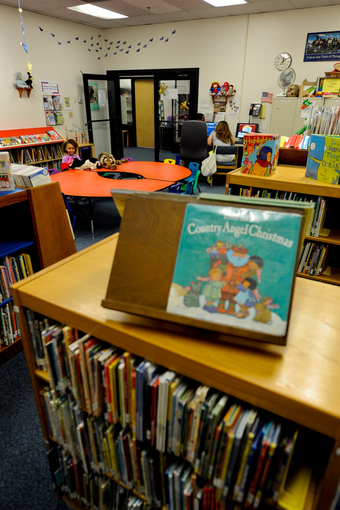 Parents check out something on the Internet while their daughter reads in the children’s library section of the Luke Air Force Base Library. The library also has baby time and story time for preschoolers and toddlers. For more information on times, call (623) 856-7191. (U.S. Air Force photo/Staff Sgt. C.J. Hatch)