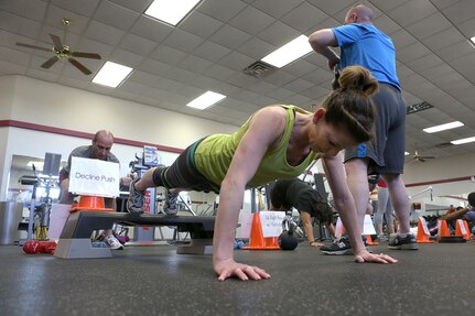 Becki Powell, wife of Master Sgt. David Powell, 37th Training Wing, works on the decline push during an Intense Circuit Training class at the Gateway Fitness Center at Joint Base San Antonio-Lackland. (U.S. Air Force photo by Robbin Cresswell/Released)