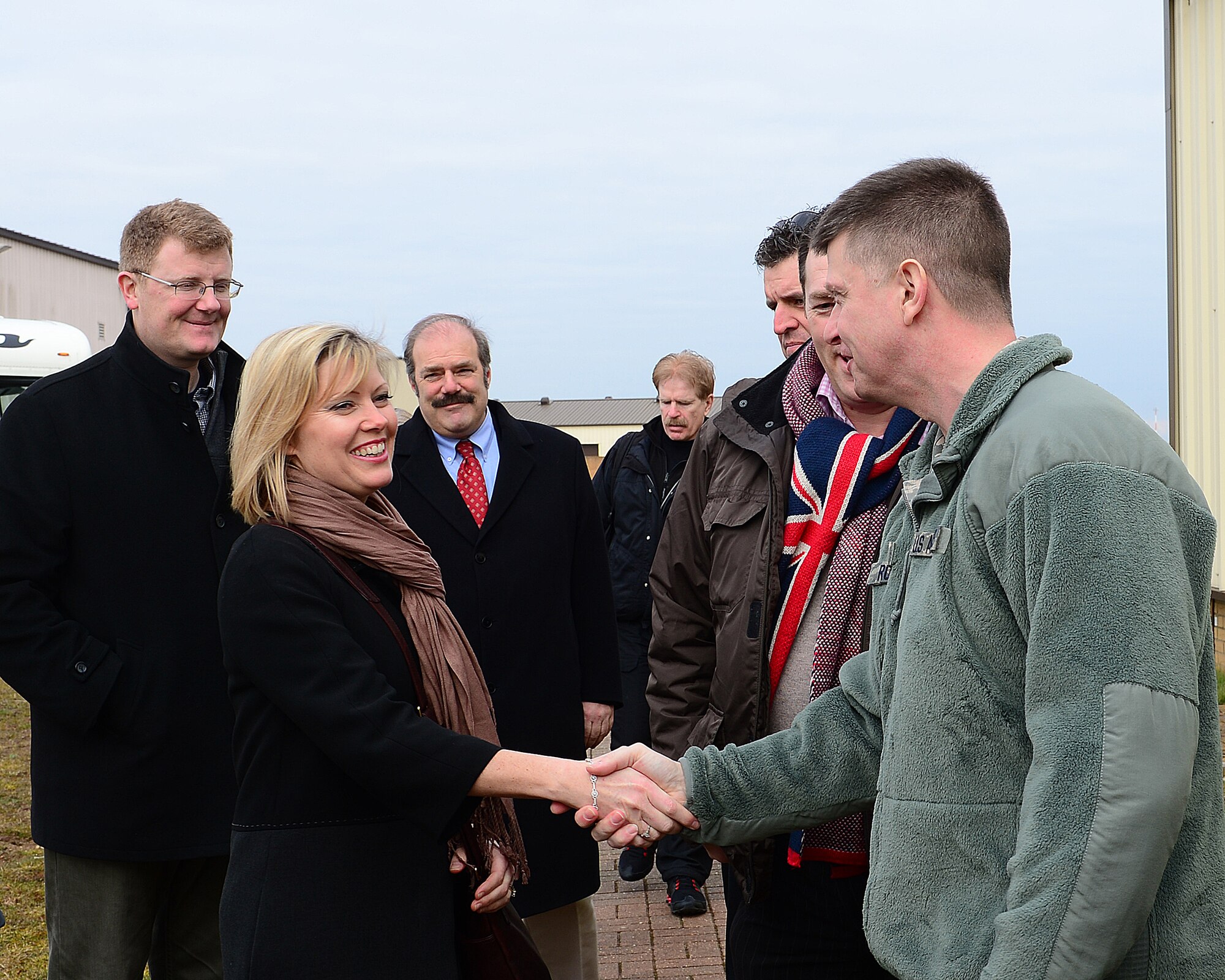 ROYAL AIR FORCE LAKENHEATH, England – Col. Kyle Robinson, 48th Fighter Wing commander, greets honorary commanders during an immersion tour March 21, 2013. The honorary commander program is designed to increase the community’s understanding of the 48th Fighter Wing’s mission by pairing local leaders with wing leaders to forge new relationships. (U.S. Air Force photo by Staff Sgt. Stephanie Mancha)
