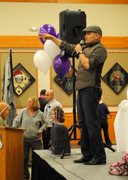 Tech. Sgt. Matthew “Ace” Acevedo, 341st Civil Engineer Squadron member, addresses the audience at the Father and Daughter Dance.  Ace was the emcee for the event as well as the disc jockey.  (U.S. Air Force photo/Senior Airman Cortney Paxton)