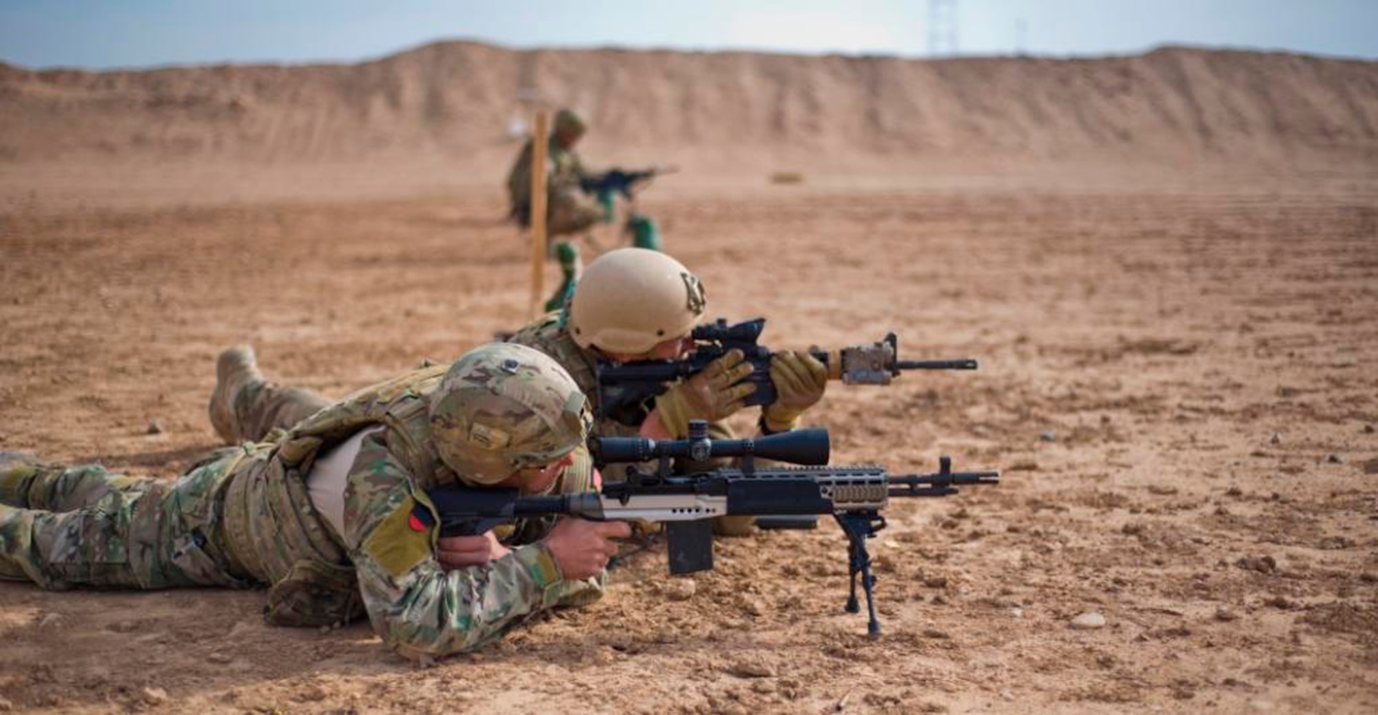 Tech. Sgt. Dustin Lambries, a 466th Operating Location Delta Explosives Ordinance Disposal team lead, fires an Mk 14 enhanced battle rifle, while Staff Sgt. Bradford Bends, 466th OL-Delta, EOD, spots their target at a firing range at Camp Leatherneck, Afghanistan, Dec. 28, 2012. After identifying the need for a more capable rifle while outside the wire, Delta upgraded its dismount teams with the EBR, enhancing their ability to respond to long-distance hostile fire. (U.S. Air Force photo/Tech. Sgt. Swift Moon)