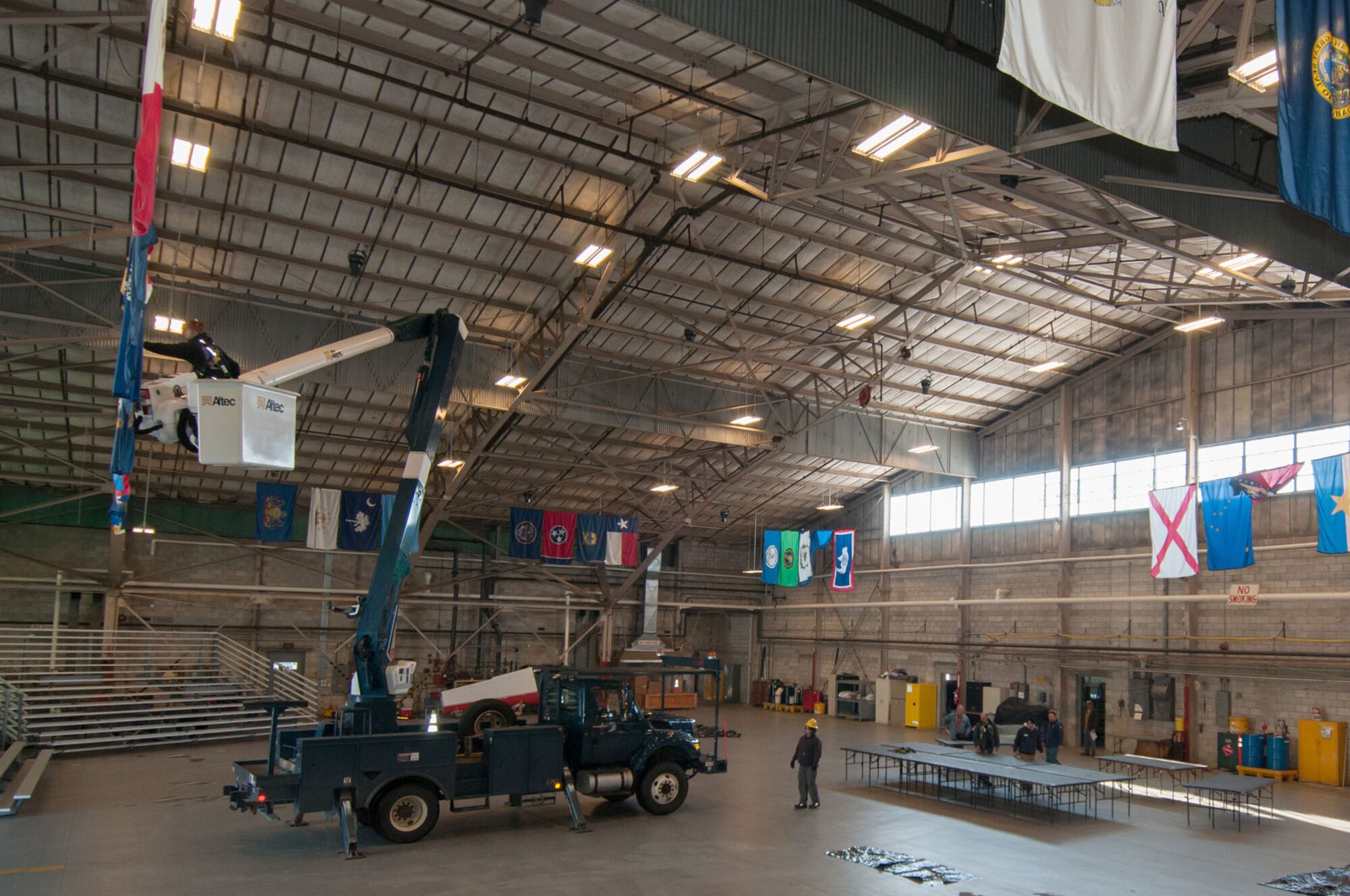 HANSCOM AIR FORCE BASE, Mass. – Workers set up the Aero Club Hangar March 20 in preparation for Town Hall meetings March 21. During the meetings, base leaders provided information on furloughs as it relates to Hanscom’s appropriated fund civilian population. (U.S. Air Force photo by Rick Berry)  