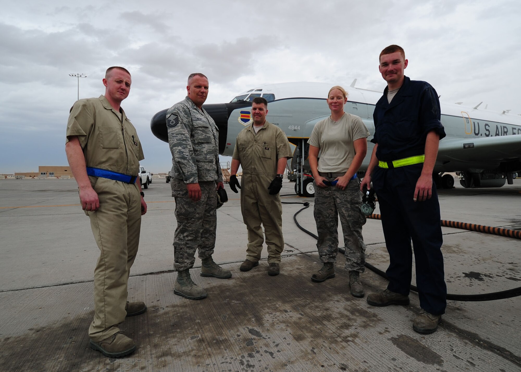 SOUTHWEST ASIA -- Members of the 763rd Expeditionary Aircraft Maintenance Unit  Airman 1st Class Colton Johnston, Master Sgt. Garrett Wight, Tech. Sgt. William Dibble, Staff Sgt. Stephanie Wang, Senior Airman Colin Roling. The 763rd EAMU is part of the 379th Expeditionary Aircraft Maintenance Squadron and is responsible for maintaining the RC-135 Rivet Joint. (U.S. Air Force photo/Master Sgt. Brendan Kavanaugh)