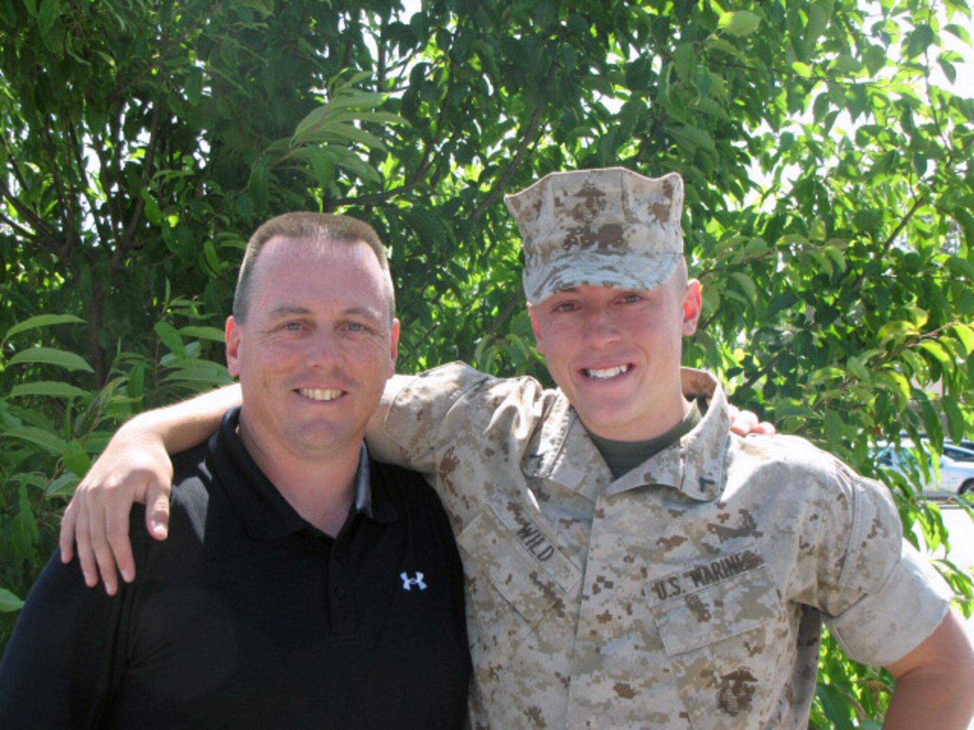 Chief Master Sgt. William T. Wild III, 512th Airlift Wing command chief, stands with his son Marine Lance Cpl. William T. Wild IV, who is one of seven Marines killed during a training exercise March 18 at Hawthorne Army Dept, Nev. The Marine, referred to as Taylor, was a Private First Class at the time of this picture. (Courtesy photo)