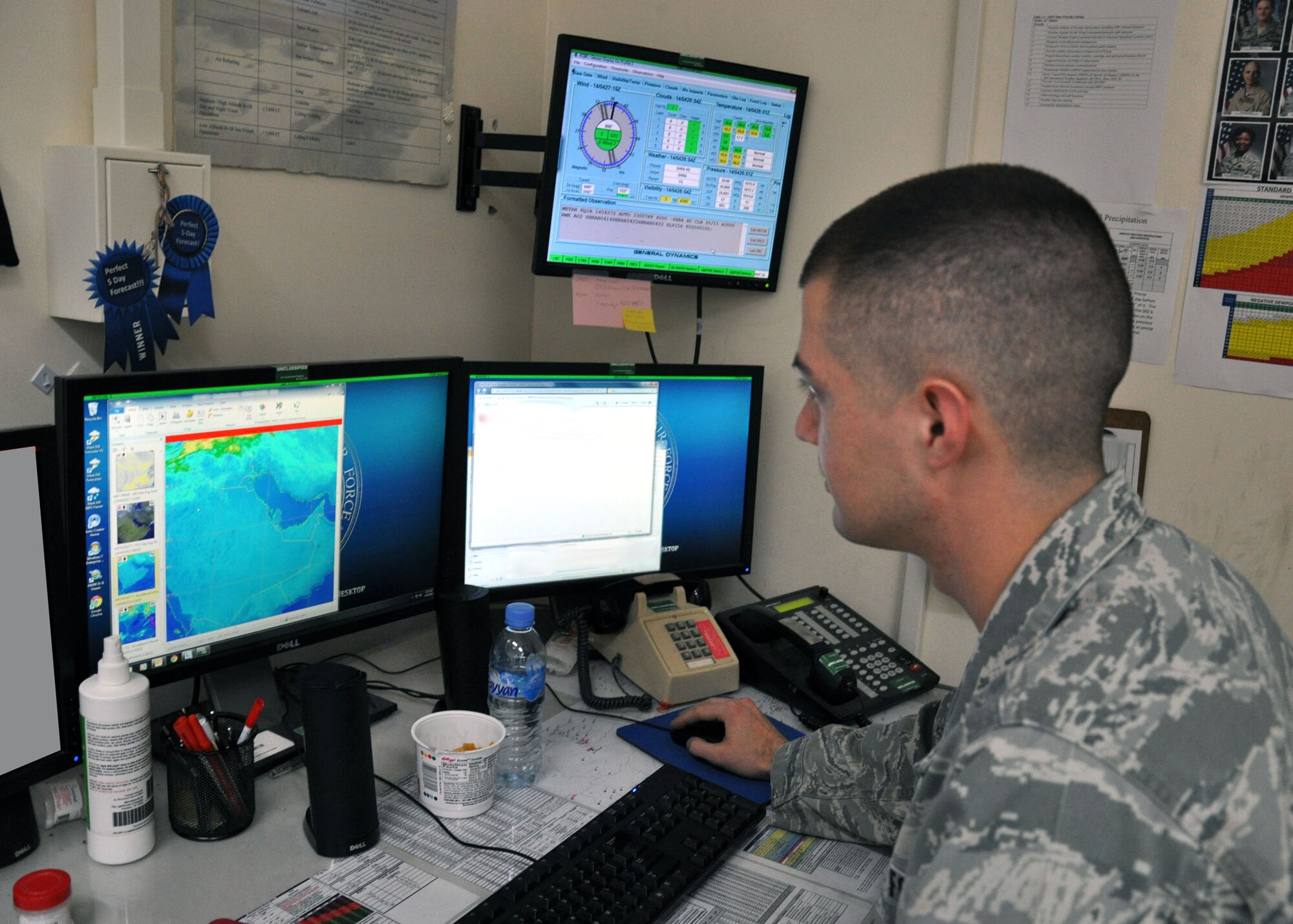 Senior Airman Samuel Strider, 379th Expeditionary Operations Support Squadron Weather Flight forecaster, uses satellite imagery to perform model initialization and verification. The weather flight combines current meteorological observations from the local airfield and regional aviation weather products to produce mission execution forecasts in support of Operation Enduring Freedom. (U.S. Air Force Photo/Capt. Angela Webb)