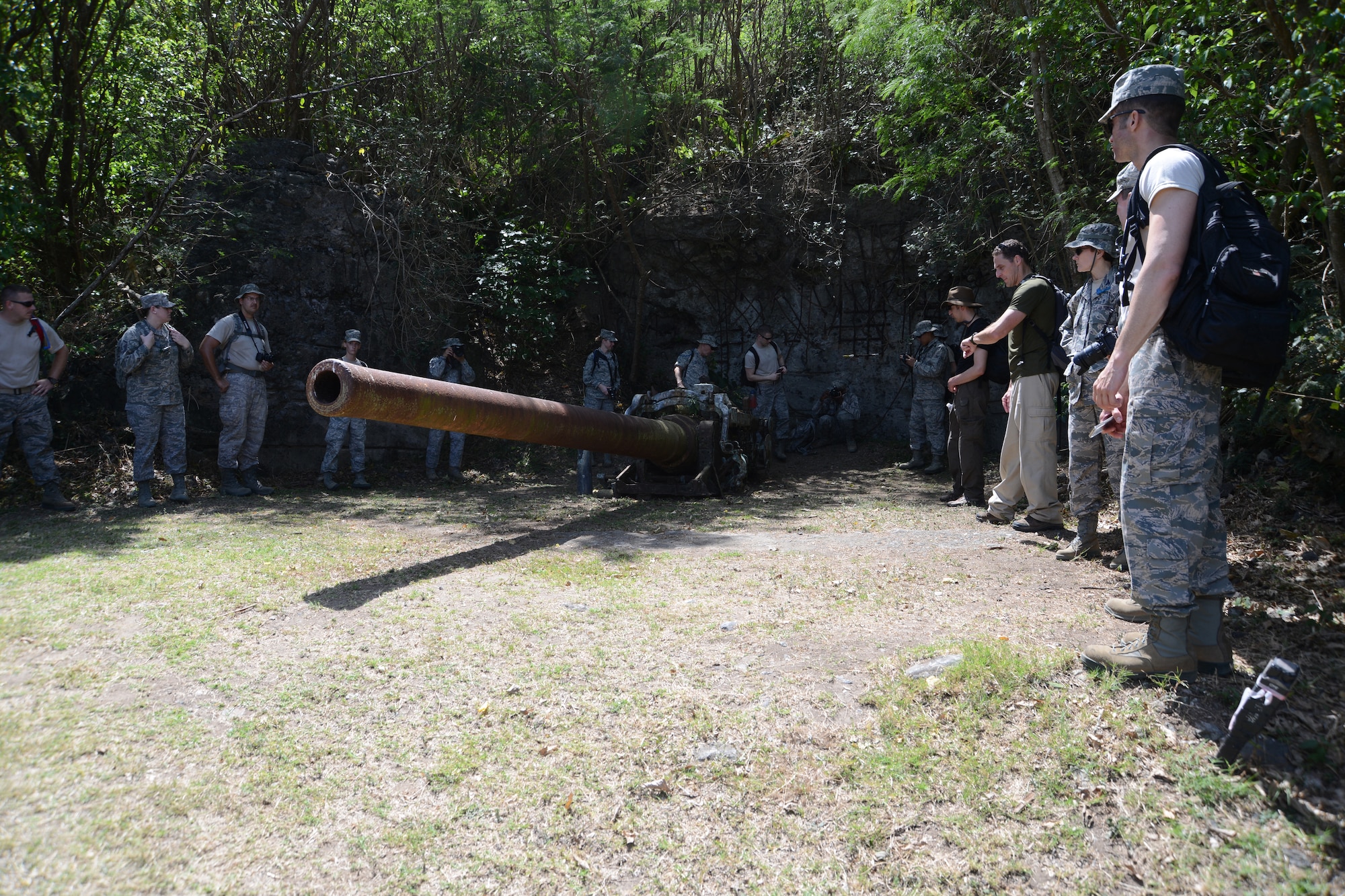 James D'Angina, 18th Wing historian, teaches members of the 18th Medical Group about Japanese artillery emplacement and a heavy Japanese naval gun during a professional development outing to Iwo To, Japan, formerly referred to as Iwo Jima, March 18, 2013. About 40 Airmen embarked on a hike to the top of Mount Suribachi on the island. (U.S. Air Force photo/Tech Sgt. Jocelyn L. Rich-Pendracki)