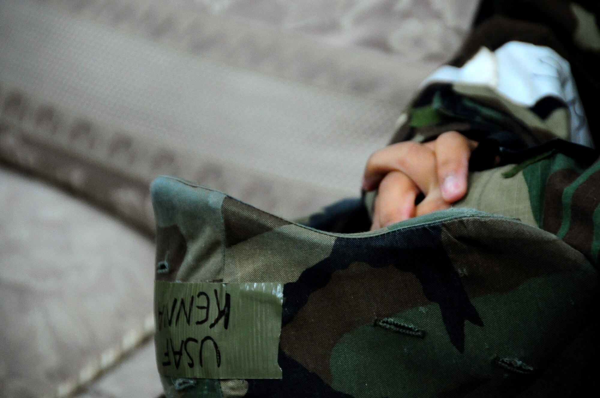 U.S. Air Force Airman 1st Class Kenna Jackson, 35th Fighter Wing Public Affairs photojournalist, sits quietly waiting for the base chaplain to arrive after being notified of the simulated death of her mother and baby sister during an Operational Readiness Exercise at Misawa Air Base, Japan, March 22, 2013.  Base chaplains are readily available for situations like this and provide comfort and guidance to both military and civilian members in need at a moment’s notice.  (U.S. Air Force photo by Staff Sgt. April Quintanilla)