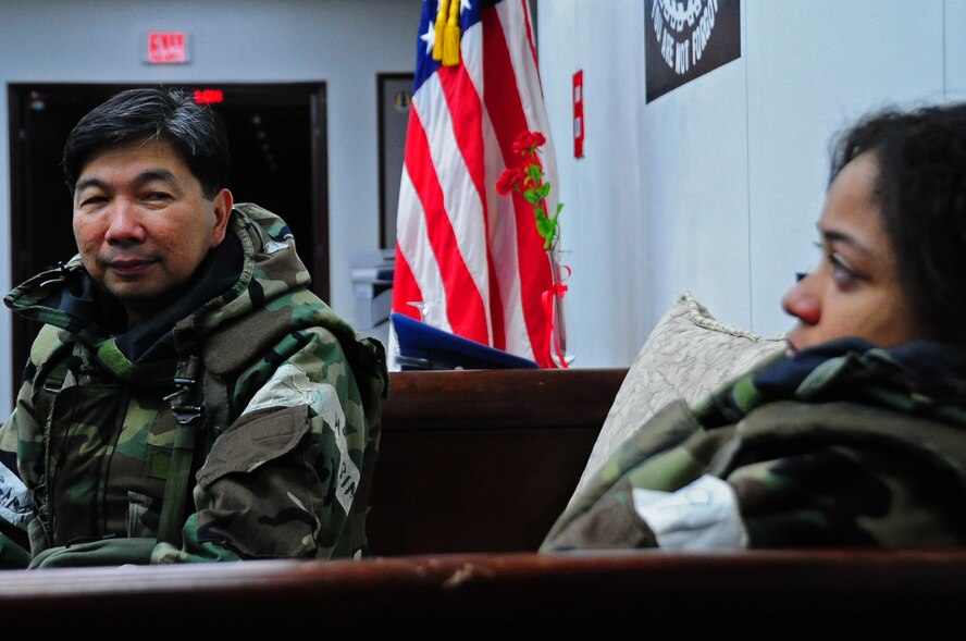 U.S. Air Force Capt. Antonio Rigonan (left), 35th Fighter Wing chaplain, provides comfort to Airman 1st Class Kenna Jackson, 35th FW Public Affairs photojournalist, after she is notified of the simulated death of her mother and baby sister during an Operational Readiness Exercise at Misawa Air Base, Japan, March 22, 2013.  Crisis counseling is one of the many tools used by the chaplains to assist members assigned to the base that experience unfortunate circumstances. (U.S. Air Force photo by Staff Sgt. April Quintanilla)