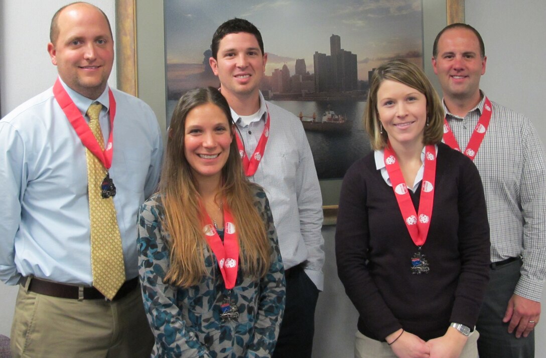 District employees pose with their medals after participating in the 35th Annual Detroit Free Press/Talmer Bank Marathon. The team finished 94th out of 535 entrants.