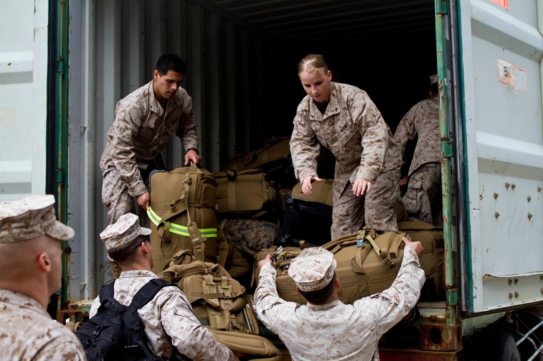 Marines and Sailors from the 31st Marine Expeditionary Unit load their gear onto a shipping container after returning from the annual Spring Patrol here, March 21. During the deployment, the Marines and Sailors participated in exercise Cobra Gold 2013 to improve interoperability with allied nations and increase regional security within the Asia-Pacific region. The unit also conducted its semiannual Certification Exercise, an event designed to ensure the 31st MEU maintains proficiency in its full spectrum of capabilities for real-world operations. The 31st MEU is the only continuously forward-deployed MEU and is the Marine Corps’ force in readiness in the Asia-Pacific region.