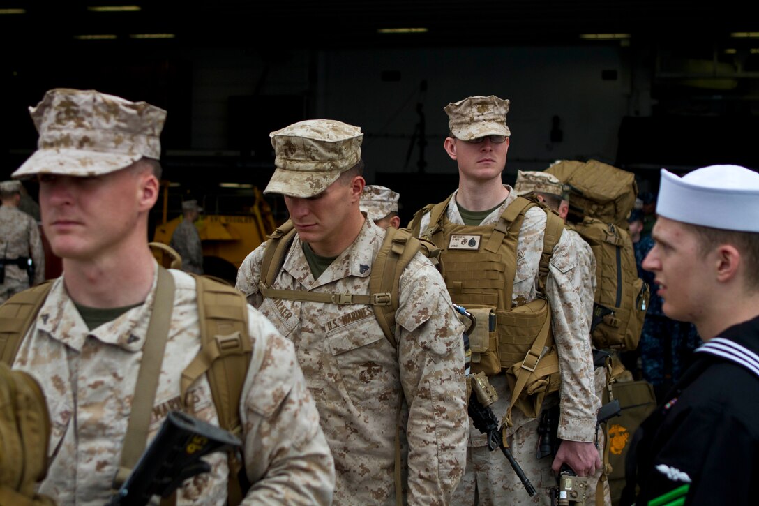 Marines and Sailors from the 31st Marine Expeditionary Unit carry their gear off of the USS Bonhomme Richard (LHD-6) after returning from the annual Spring Patrol here, March 21. During the deployment, the Marines and Sailors participated in exercise Cobra Gold 2013 to improve interoperability with allied nations and increase regional security within the Asia-Pacific region. The unit also conducted its semiannual Certification Exercise, an event designed to ensure the 31st MEU maintains proficiency in its full spectrum of capabilities for real-world operations. The 31st MEU is the only continuously forward-deployed MEU and is the Marine Corps’ force in readiness in the Asia-Pacific region.