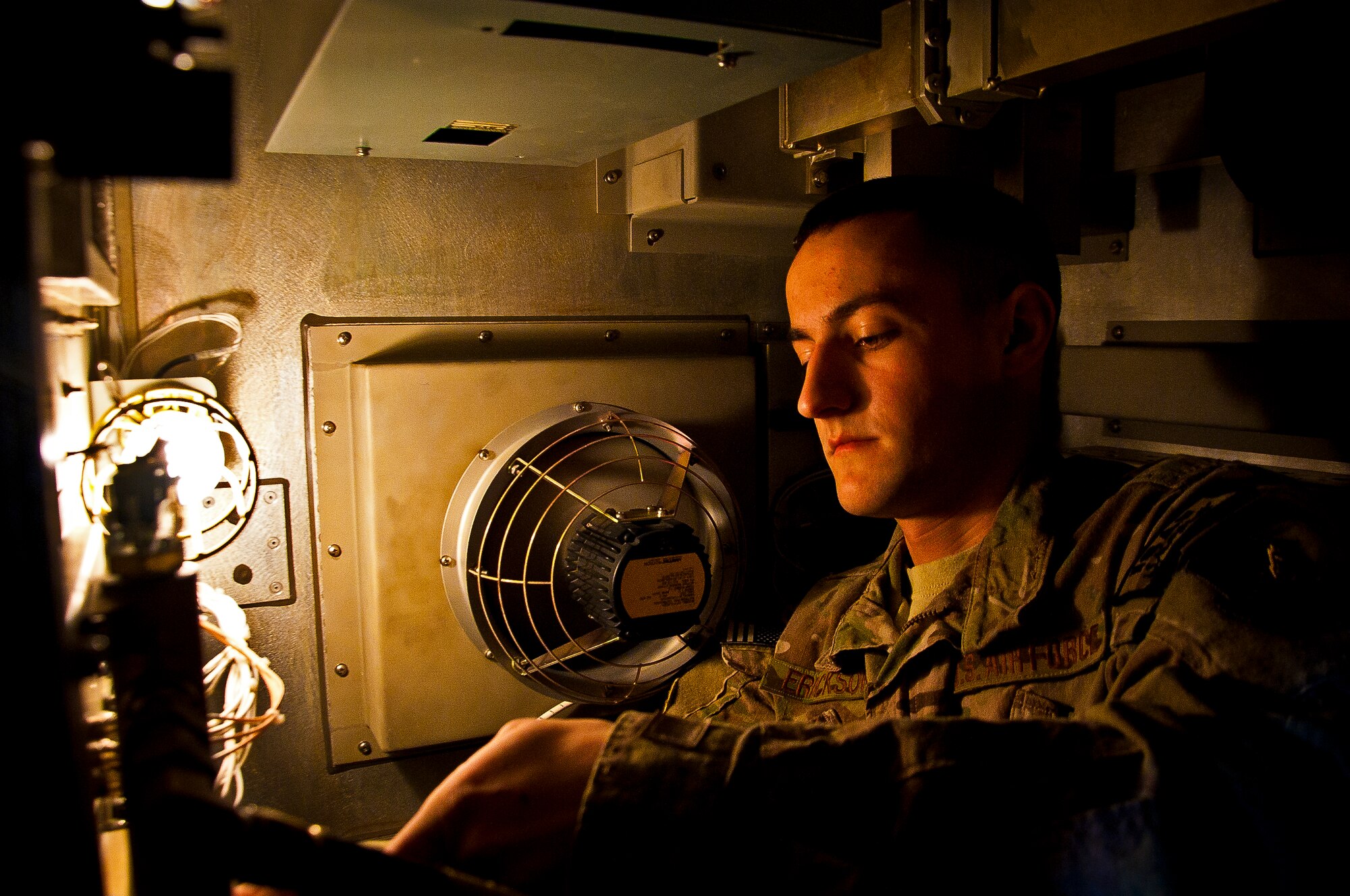 Airman 1st Class Zachary Erickson, 73rd Expeditionary Air Control Squadron, goes through a checklist of preventative maintenance at Kandahar Airfield, Afghanistan, March 13, 2012. The EACS supports the enduring airpower mission through air control and data support by making sure a constant radar feed is available from various sources throughout Afghanistan. (U.S. Air Force photo/Senior Airman Scott Saldukas)