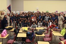 Marine Corps Activity Guam poses for a group picture with the Marine Corps Junior Reserve Officer Training Corps, Okkodo High School, Dededo, Guam, March 20, 2013. The Okkodo HS is the only school on Guam to support the Marine Corps JROTC program, and supports the Marine presence on Guam in the form of ceremonies and other events.