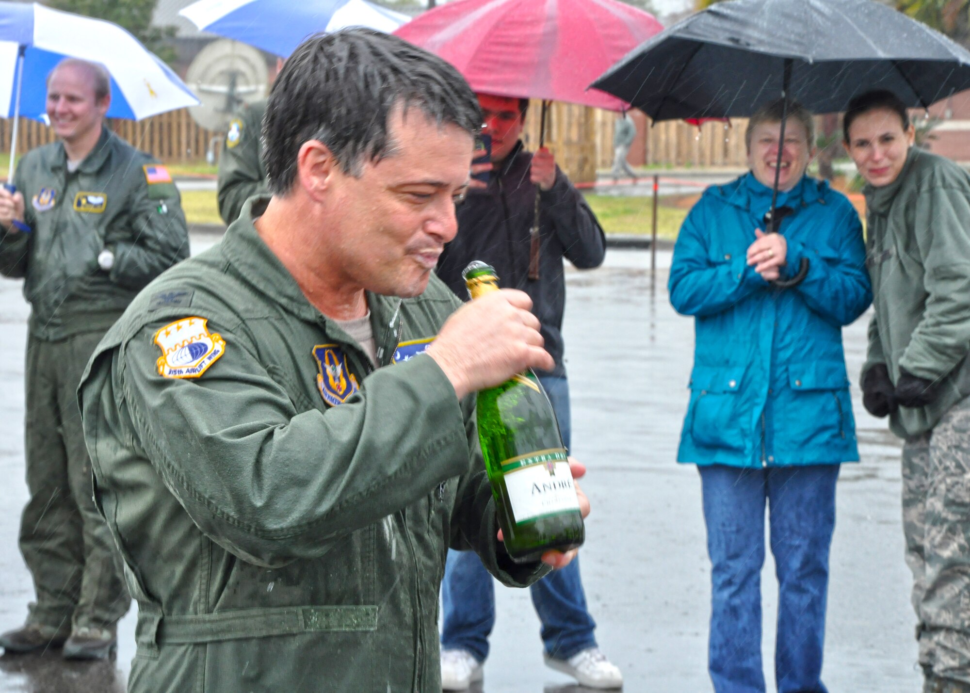 Col. Russell Fingar, 315th Airlift Wing vice commander, celebrates his last military flight with a sip of champagne March 23, 2013 at Joint Base Charleston, S.C. Fingar’s fini flight was a salute to his more than 26 years of service in the U.S. Air Force, and he will officially retire from the USAF April 01, 2013. (U.S. Air Force Photo/Staff Sgt. Shane Ellis)