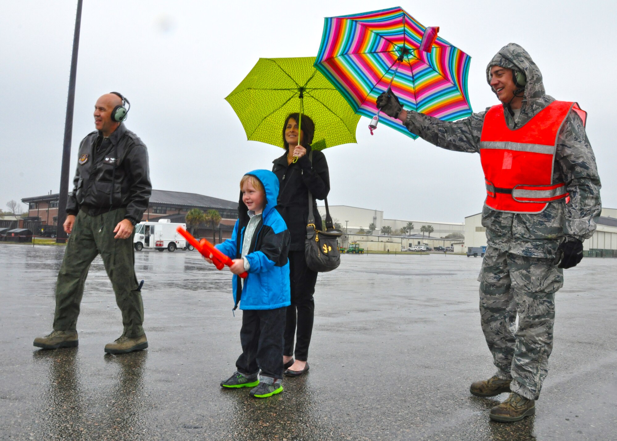 Col. Russell Fingar’s grandson puts wands in motion and marshals Fingar’s C-17 Globemaster III to a stop March 23, 2013 at Joint Base Charleston, S.C. The colonel’s final military flight was celebrated by a host of friends and family members and served as a salute to Fingar and his more than 26 years of service in the U.S. Air Force. Fingar will officially retire from the USAF April 01, 2013. (U.S. Air Force Photo/Staff Sgt. Shane Ellis)