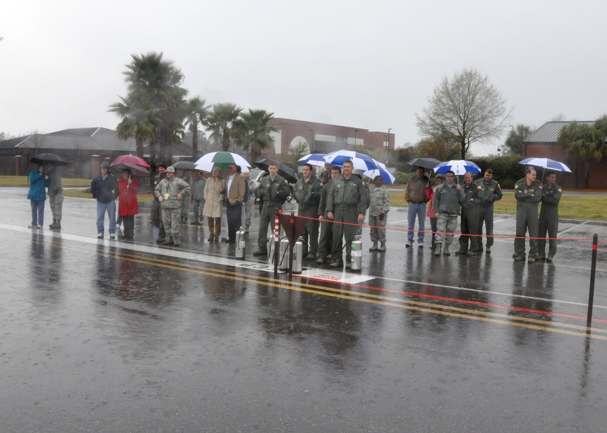 A crowd gathers to greet Col. Russell Fingar, 315th Airlift Wing vice commander, as he completes his fini flight March 23, 2013 at Joint Base Charleston, S.C. Fingar’s “fini flight” served as a final aviation salute to the colonel and his more than 26 years of service in the U.S. Air Force. Fingar will officially retire from the USAF April 01, 2013. (U.S. Air Force Photo/Staff Sgt. Shane Ellis)