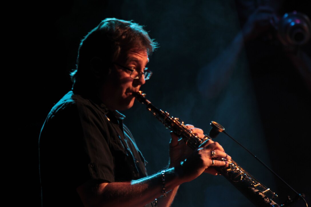 Mitch Paliga, saxophone player, Lt. Dan Band, plays his part for the Combat Center crowd at the Sunset Cinema.