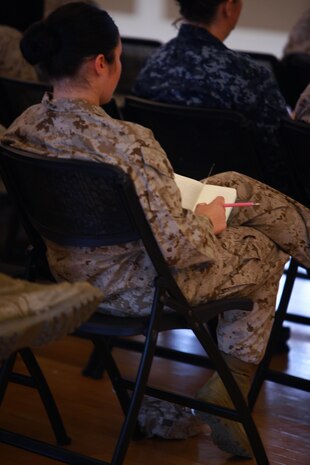 A Marine with 2nd Marine Logistics Group takes notes during an information security class held aboard Camp Lejeune, N.C., March 18, 2013. More than 60 Marines attended the class, which was designed to prepare the Marines to provide information security training for their peers in the military. 