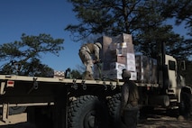 Marines with 2nd Supply Battalion, Combat Logistics Regiment 25, 2nd Marine Logistics Group prepare a pallet of food for 10th Marine Regiment, 2nd Marine Division during the joint training exercise Rolling Thunder at Fort Bragg, N.C., March 14, 2013. Several detachments from 2nd MLG formed a logistics combat element and provided supply and maintenance support for 10th Marines throughout Rolling Thunder. 