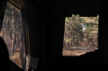 The view from inside a Mine Resistant All-Terrain Vehicle as it travels the back roads of Fort Bragg, N.C., while Marines with 2nd Supply Battalion, 2nd Marine Logistics Group search for open paths between their command operation center and the administration logistics operation centers of the 10th Marine Regiment, 2nd Marine Division during the joint training exercise Rolling Thunder, March 13, 2013. The battalion’s scouting missions ensured that resupply missions were completed quickly and efficiently. 