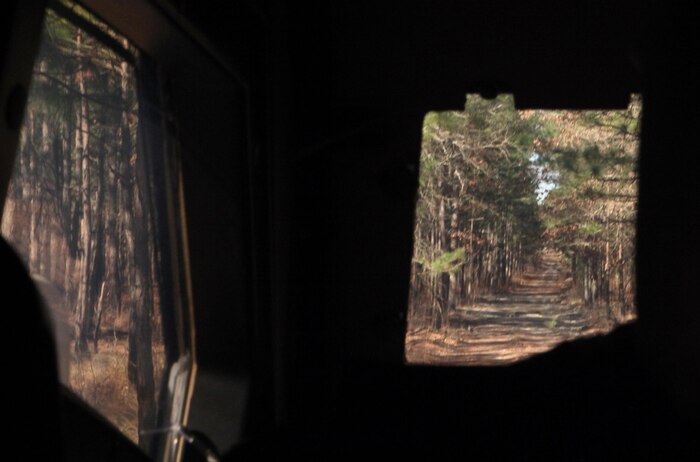 The view from inside a Mine Resistant All-Terrain Vehicle as it travels the back roads of Fort Bragg, N.C., while Marines with 2nd Supply Battalion, 2nd Marine Logistics Group search for open paths between their command operation center and the administration logistics operation centers of the 10th Marine Regiment, 2nd Marine Division during the joint training exercise Rolling Thunder, March 13, 2013. The battalion’s scouting missions ensured that resupply missions were completed quickly and efficiently. 