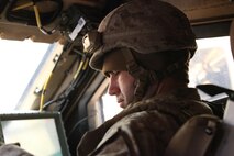 Staff Sgt. Joseph L. Sailer, a Monroe, N.C., native and the motor transportation operations chief for 2nd Marine Logistics Group’s logistical combat element, or LCE, during the joint training exercise Rolling Thunder, contacts the unit’s command operation center with a radio while he scouts for open roads at Fort Bragg, N.C., March 13, 2013. The LCE provided supply and maintenance support for the 10th Marine Regiment, 2nd Marine Division, which carried out live-fire artillery training. 
