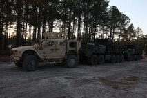 A convoy of vehicles, which belongs to 2nd Marine Logistics Group’s logistical combat element, await a supply run to aid 10th Marine Regiment, 2nd Marine Division during the joint training exercise Rolling Thunder at Fort Bragg, N.C., March 17, 2013. Resupply missions were vital to the 10th Marines’ training exercises and ran efficiently with the assistance of reconnaissance missions along the roads. 