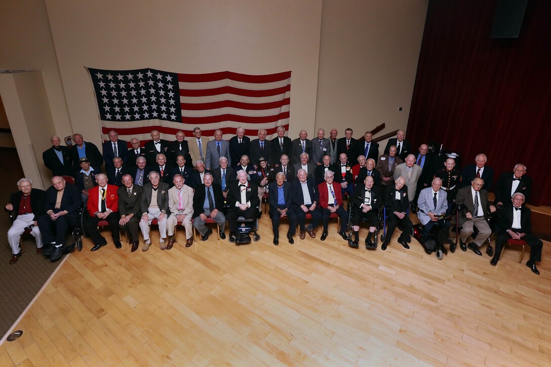 More than 50 Iwo Jima veteran’s gather for a group photo during the 68th annual Battle of Iwo Jima Commemoration ceremony at the Pacific Views Event Center here March 23.