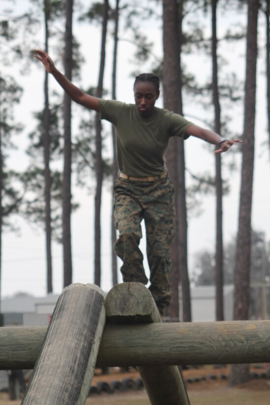 MARINE CORPS BASE QUANTICO, Va. — Midshipman Meatrice Starr maneuvers through an obstacle course during her participation in the Naval Reserve Officers Training Corps (NROTC) Scholarship Program at Savannah State University (SSU) in Savannah, Ga. Starr, 22, a Decatur, Ga. native and homeland security and emergency management major, received the Marine Corps’ Frederick C. Branch Leadership Scholarship to complete her bachelor’s degree and is now only weeks away from receiving a commission as a second lieutenant in the Marine Corps. (Courtesy Photo)
 
