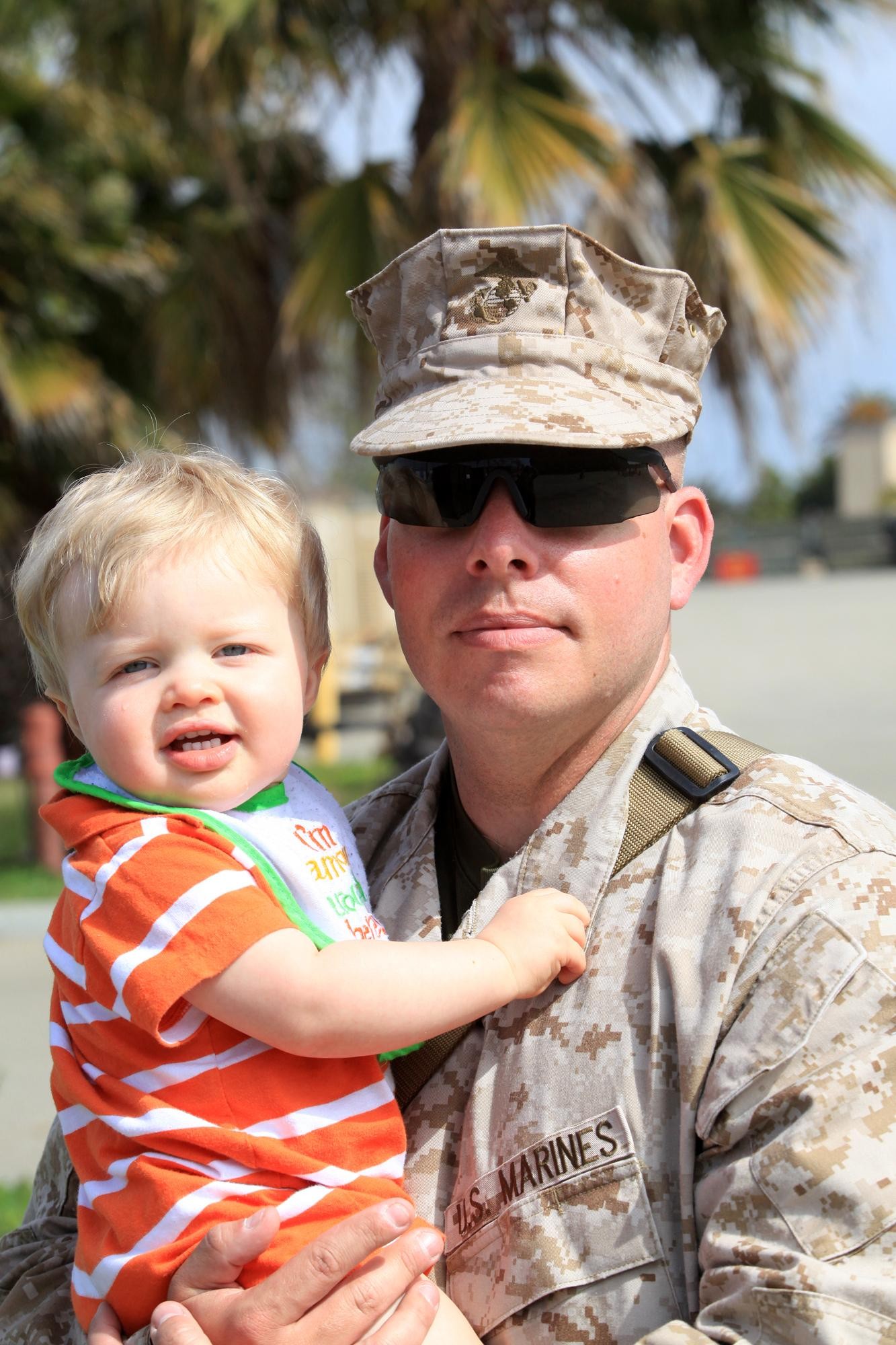 Staff Sgt. Michael Kwiecinski, a data chief with Georgian Liaison Team 8, holds his son one last time before departing for a seven-month deployment to Afghanistan at Camp Pendleton, Calif., March 22. During their deployment, members from GLT 8 along with Marines from 1st Air Naval Gunfire Liaison Company will provide a link between soldiers from the Georgian Army and Marines operating in southern Afghanistan.
