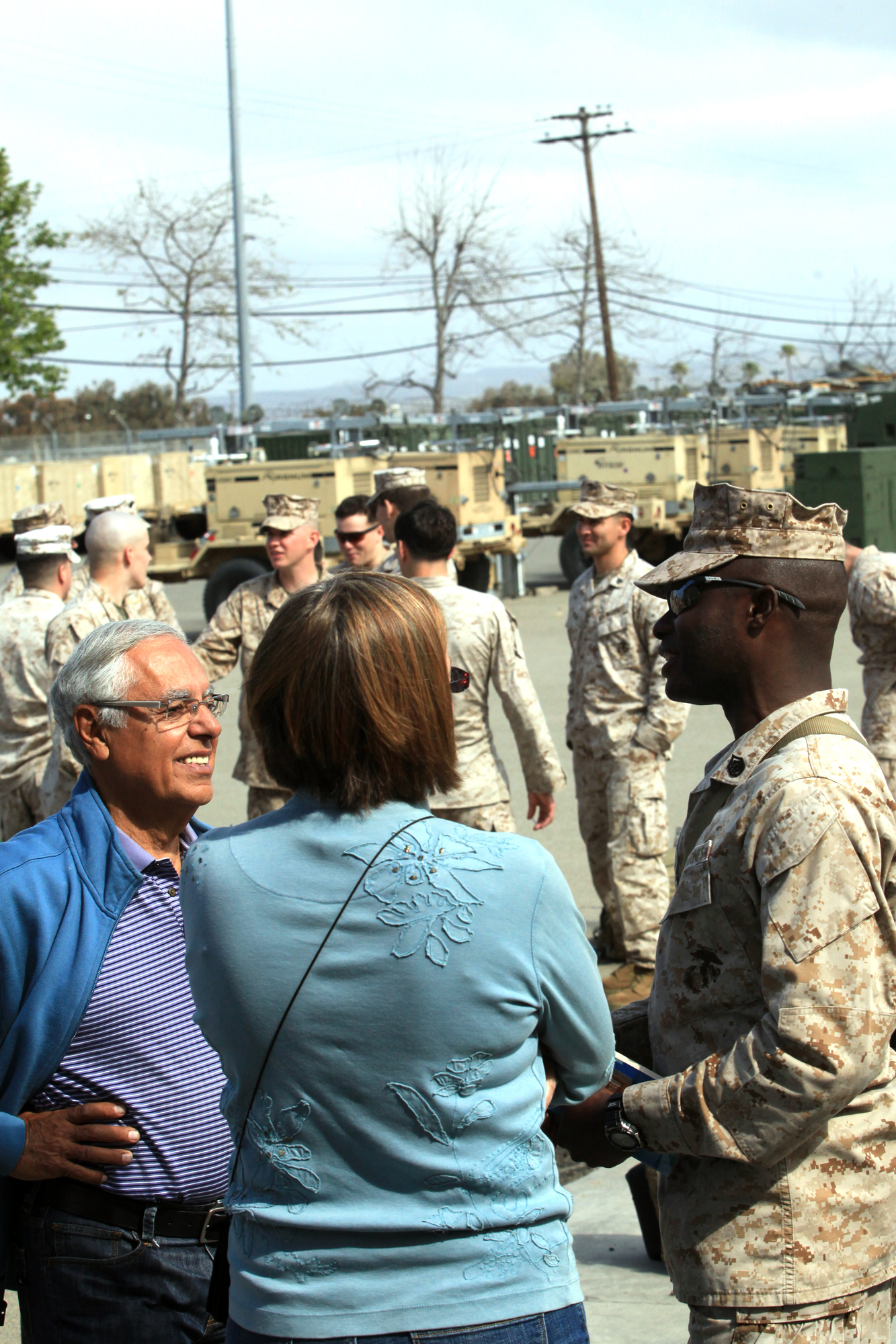 Staff Sgt. Yusuf Sesay, the liaison staff noncommissioned officer with Georgian Liaison Team 8, from Hyattsville, Md., bids farewell to fellow church members before departing for a seven-month deployment to Afghanistan at Camp Pendleton, Calif., March 22. During their deployment members from GLT 8 along with Marines from 1st Air Naval Gunfire Liaison Company will provide a link between soldiers from the Georgian Army and Marines operating in southern Afghanistan.