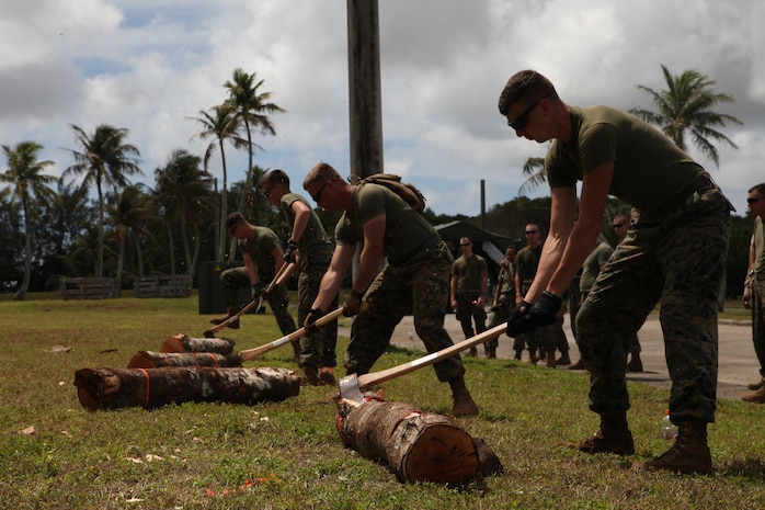 Corpsmen and Marines chop logs March 15 during a field meet on NCTS.  The Marines are part of Guahan Shield, an exercise designed to facilitate multiservice engagements, set conditions for bilateral and multilateral training opportunities, and support rapid response to potential crises and contingency operations in the Asia-Pacific region.  The Marines are part of Combat Logistics Detachment 39, 9th Engineer Support Battalion, 3rd Marine Logistics Group, III Marine Expeditionary Force. 