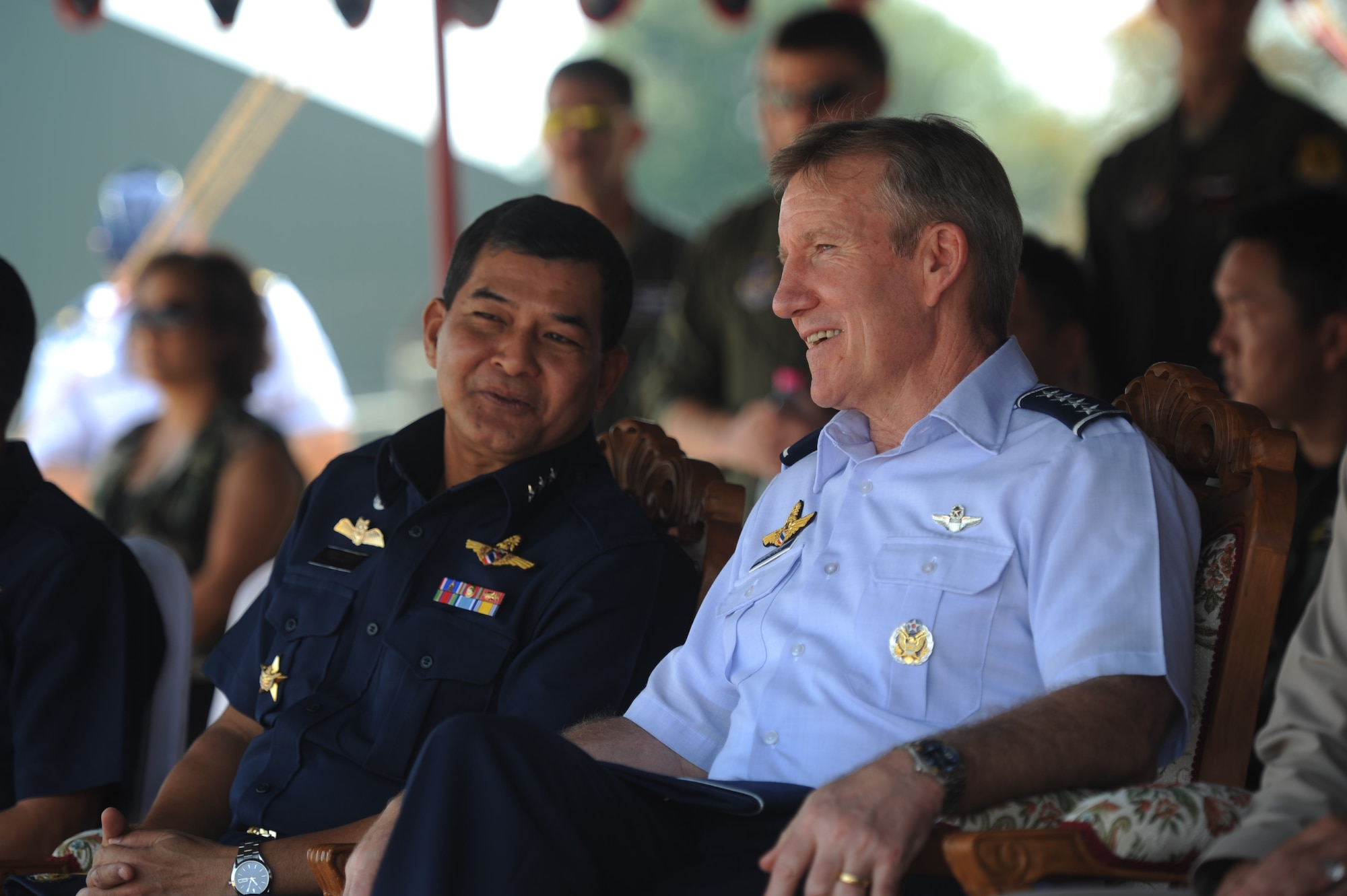 Gen. Hawk Carlisle, right, commander of Pacific Air Forces, sits beside Commander in Chief of the Royal Thai Air Force Air Chief Marshal Prajin Juntong during the closing ceremony for Cope Tiger 13 at Korat Royal Thai Air Force Base, Thailand, March 22, 2013. More than 300 U.S. service members are participating in CT13, which offers an unparalleled opportunity to conduct a wide spectrum of large force employment air operations and strengthen military-to-military ties with two key partner nations, Thailand and Singapore. (U.S. Air Force photo/2nd Lt. Jake Bailey)