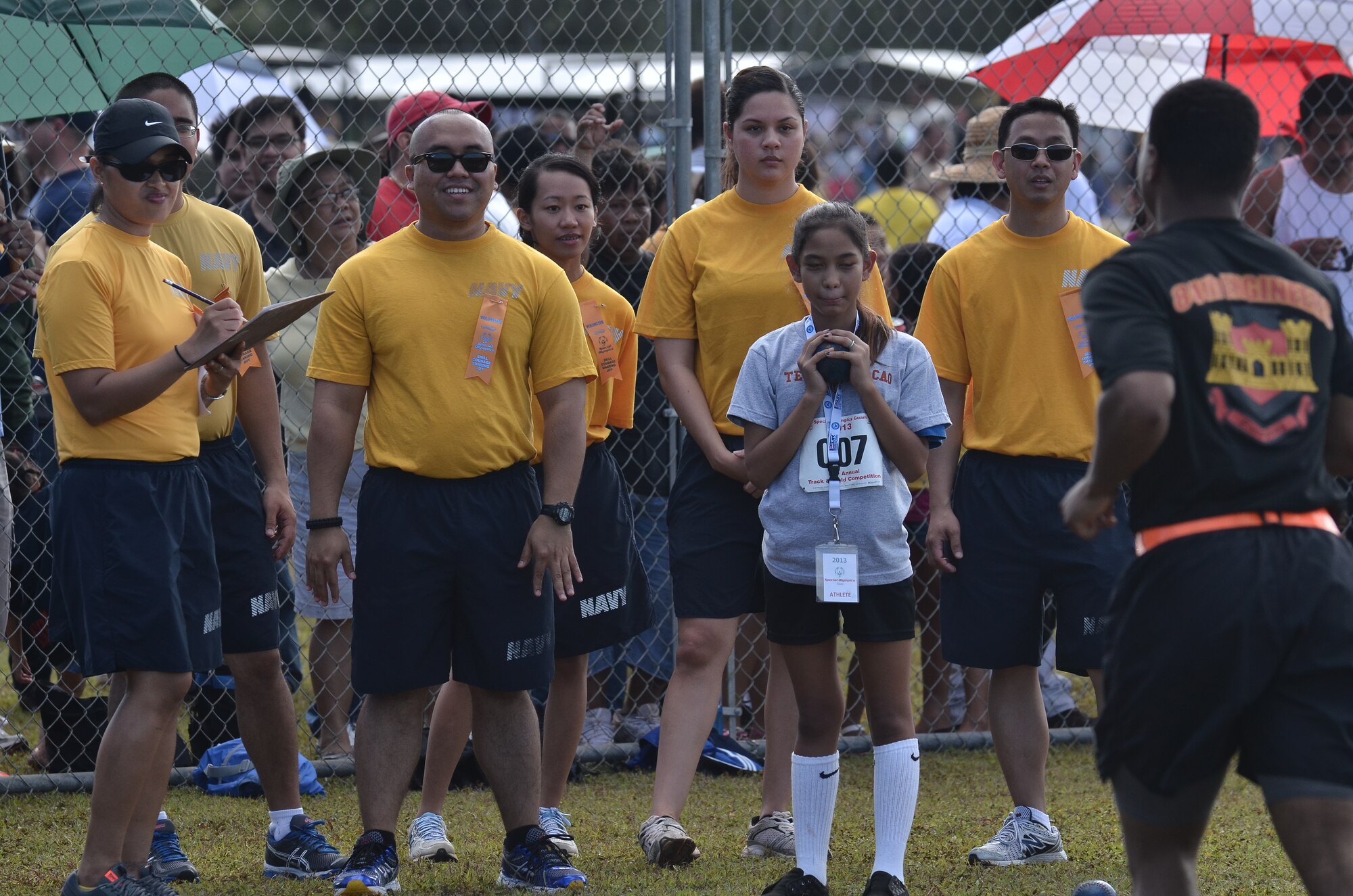 Sailors cheer on a Special Olympics athlete during the 37th Annual Special Olympics of Guam Track and Field event at Okkodo High School in Dededo, Guam, March 23, 2013.  More than 300 service members from all military branches came together to support Special Olympic athletes in a variety of Olympic-type sports for children and adults with intellectual disabilities, giving them continuing opportunities to develop physical fitness and demonstrate courage.  (U.S. Air Force photo/Staff Sgt. Alexandre Montes/Released)