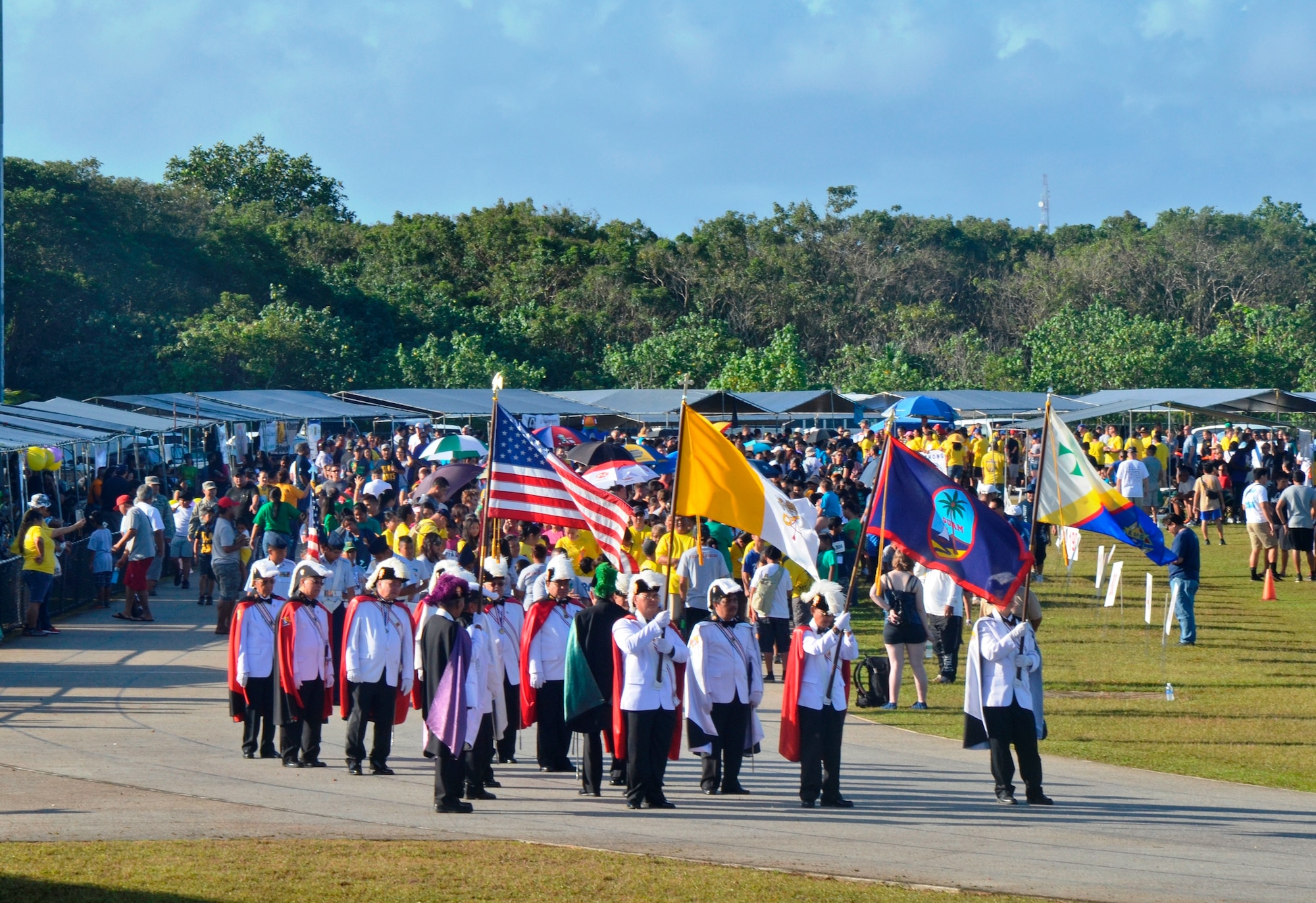 The Guam Knights of Columbus lead the opening ceremony during the 37th Annual Special Olympics of Guam Track and Field event at Okkodo High School in Dededo, Guam, March 23, 2013.  The Special Olympics mission is to provide year-round sports training and athletic competition in a variety of Olympic-type sports for children and adults with intellectual disabilities, giving them continuing opportunities to develop physical fitness and demonstrate courage. (U.S. Air Force photo/Staff Sgt. Veronica McMahon/Released)