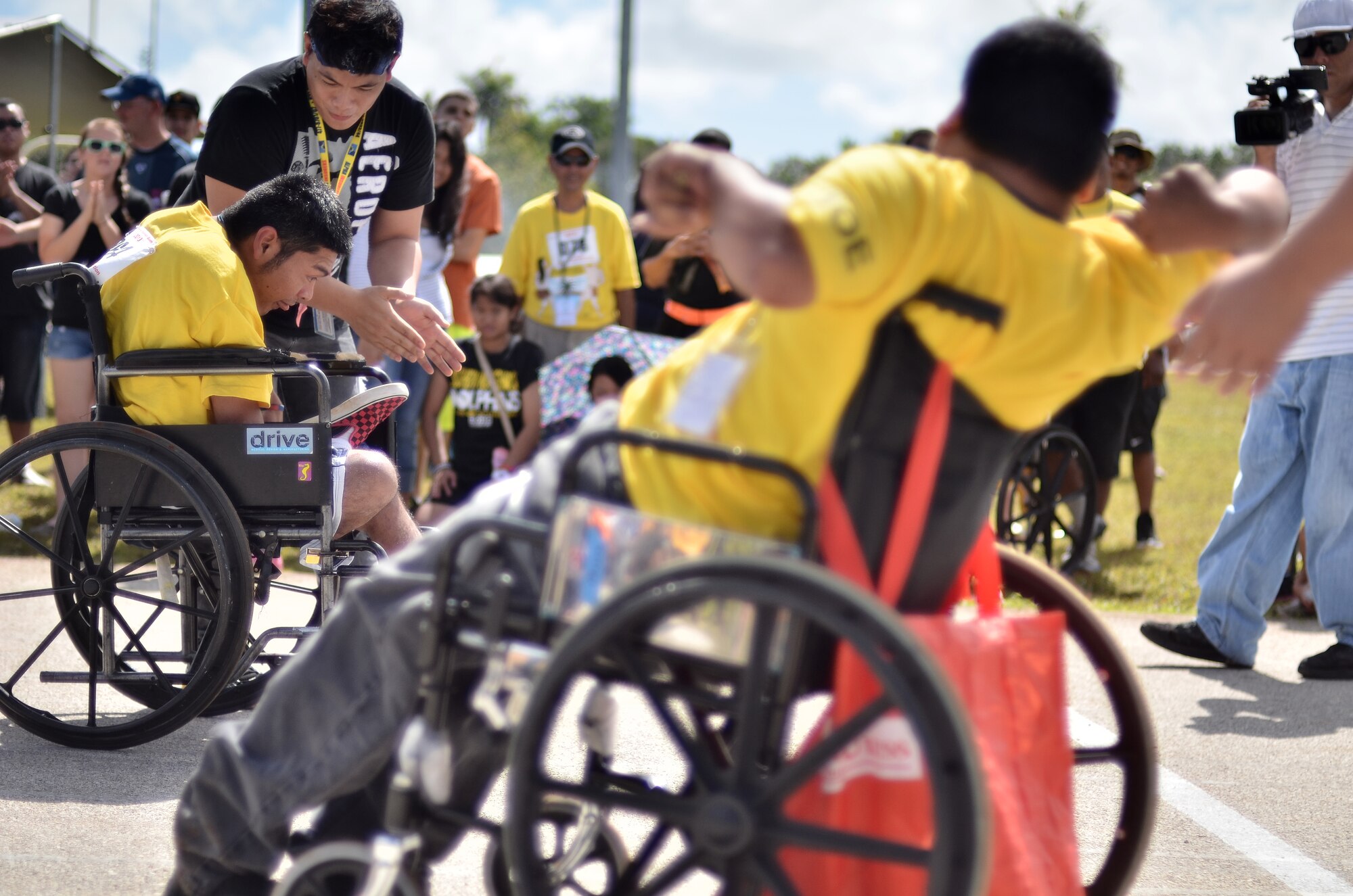 Moses Buas, Special Olympics of Guam athlete, races to the finish line during the 37th Annual Special Olympics of Guam Track and Field event at Okkodo High School in Dededo, Guam, March 23, 2013.  The Special Olympics mission is to provide year-round sports training and athletic competition in a variety of Olympic-type sports for children and adults with intellectual disabilities, giving them continuing opportunities to develop physical fitness and demonstrate courage. (U.S. Air Force photo/Staff Sgt. Alexandre Montes/Released)