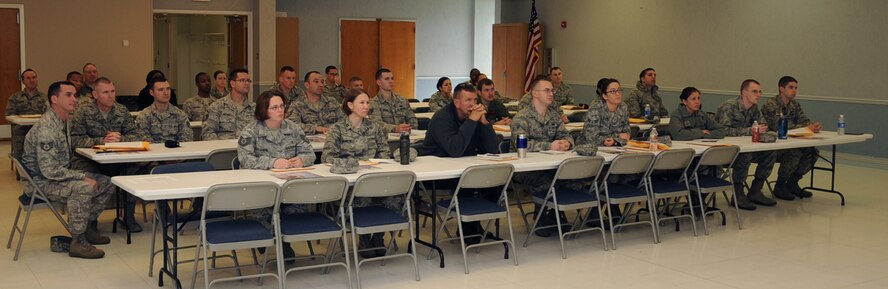 Airmen listen as Col. Andrew Gebara, 2nd Bomb Wing commander, give his remarks during the Air Force Assistance Fund kick off on Barksdale Air Force Base, La., March 25. The AFAF was established to raise funds for the charitable affiliates that provide support to the Air Force family. (U.S. Air Force photo/Senior Airman Sean Martin)