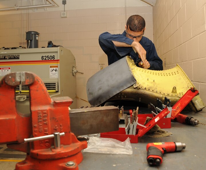 Staff Sgt. Ruben Pacheco, 2nd Maintenance Squadron Aircraft Structural Maintenance, repairs a 30 percent duct from a B-52H Stratofortress on Barksdale Air Force Base, La., March 25. The duct is one of eight exhaust ducts used in the engine of the aircraft. (U.S. Air Force photo/Senior Airman Sean Martin)