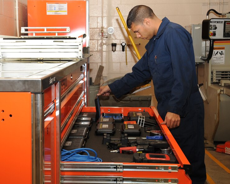 Staff Sgt. Ruben Pacheco, 2nd Maintenance Squadron Aircraft Structural Maintenance, looks for a tool to use on a 30 percent duct from a B-52H Stratofortress on Barksdale Air Force Base, La., March 25. The duct is one of eight exhaust ducts used in the engine of the aircraft. (U.S. Air Force photo/Senior Airman Sean Martin)