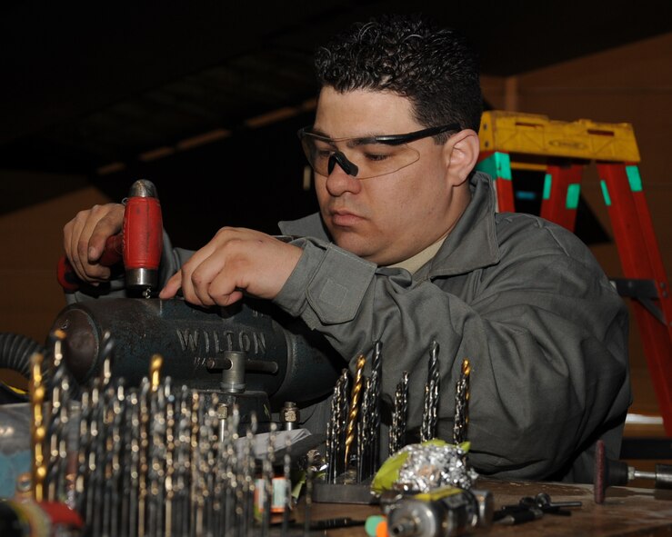 Staff Sgt. Dustin Reynolds, 2nd Maintenance Squadron Aircraft Structural Maintenance, hammers a part on Barksdale Air Force Base, La., March 25. Structural maintainers are responsible for corrosion control, structural maintenance and repairing rivets and the skin of a B-52H Stratofortress. (U.S. Air Force photo/Senior Airman Sean Martin)