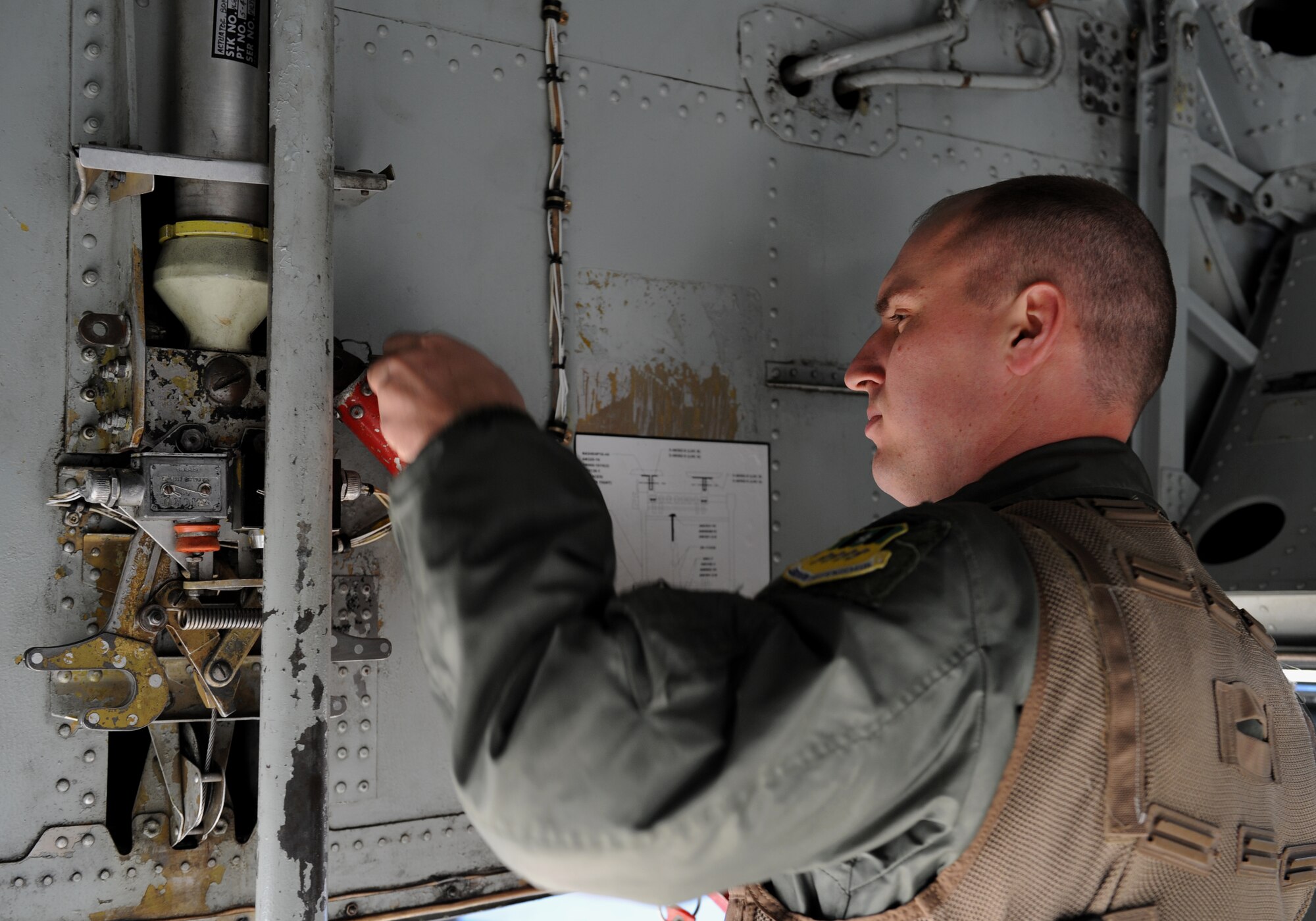 Capt. Matthew Middlebrooks, 20th Bomb Squadron radar navigator, removes a piece of equipment from a B-52H Stratofortress on Barksdale Air Force Base, La., March 25. Members of the aircrew inspect the aircraft before going inside. Each member has his or her own specific items of interest they look at as they conduct their inspections before take-off. (U.S. Air Force photo/Airman 1st Class Benjamin Gonsier)
