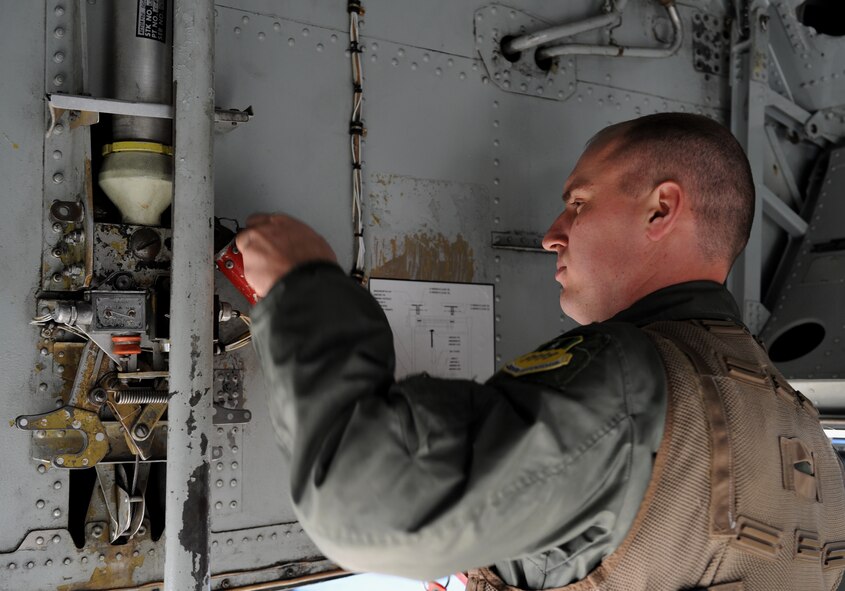 Capt. Matthew Middlebrooks, 20th Bomb Squadron radar navigator, removes a piece of equipment from a B-52H Stratofortress on Barksdale Air Force Base, La., March 25. Members of the aircrew inspect the aircraft before going inside. Each member has his or her own specific items of interest they look at as they conduct their inspections before take-off. (U.S. Air Force photo/Airman 1st Class Benjamin Gonsier)