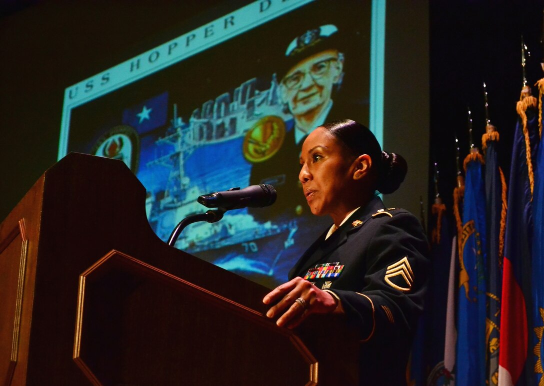 U.S. Army Staff Sgt. Karla Smith, assigned to the 11th Transportation Battalion, 7th Sustainment Brigade, tells the brief history of former computer scientist and U.S. Navy Rear Adm. Grace Hopper during the 7th Sus. Bde.’s “Women Inspiring Innovation Through Imagination” event at Jacobs Theater at Fort Eustis, Va., March 19, 2013. The observance, hosted by 7th Sus. Bde. commander Col. Jennifer Reinkober, featured rich history and highlighted the extraordinary achievements of American women. (U.S. Army photo by Sgt. Edwin Rodriguez/Released)