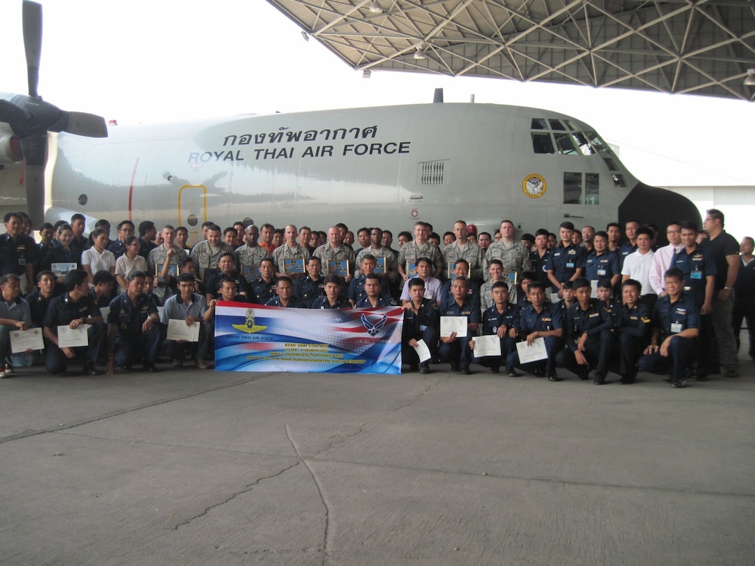 Members of the 373rd Training Squadron Field Training Detachment 4 from Little Rock Air Force Base, Ark., pose with their Royal Thai Air Force counterparts from the 601st Airlift Squadron at the conclusion of training March 8, 2013, at Don Muang Air Base, Thailand. The training was part of a month-long C-130 maintenance mobile training team deployment for the Royal Thai Air Force in Bangkok. (U.S. Air Force courtesy photo)   