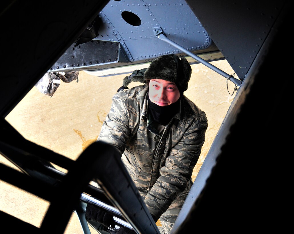 Tech. Sgt. Matthew Cain, 459th Aircraft Maintenance Squadron crew chief, exits a KC-135 Stratotanker on March 25, 2013 at Joint Base Andrews, Md. Despite the cold weather conditions, Joint Base Andrews service members fulfill their mission essential tasks. (U.S. Air Force photo/Airman 1st Class Erin O’Shea)    